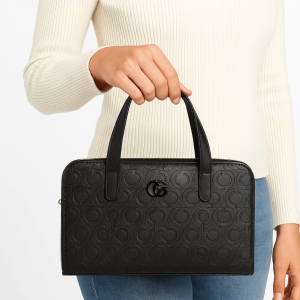 black handbag with girl holding it